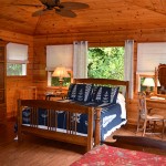 Waipio Wayside, Birds Eye Room, High cieling room, wooden walls and ceiling, ceiling fan, bed and tables